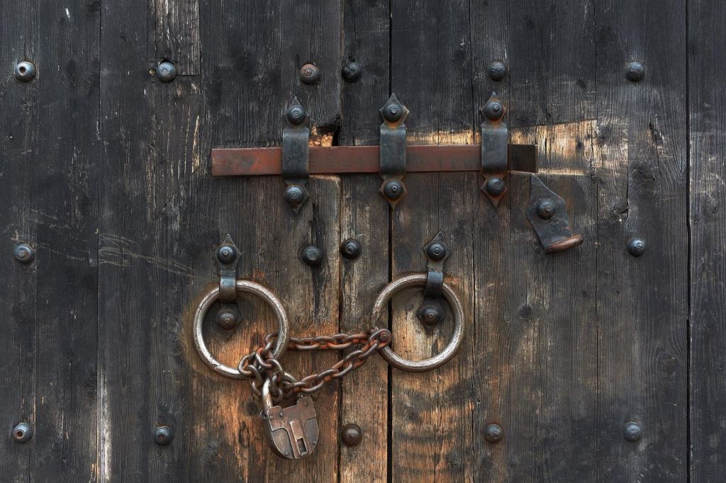 Padlock on Wooden Door